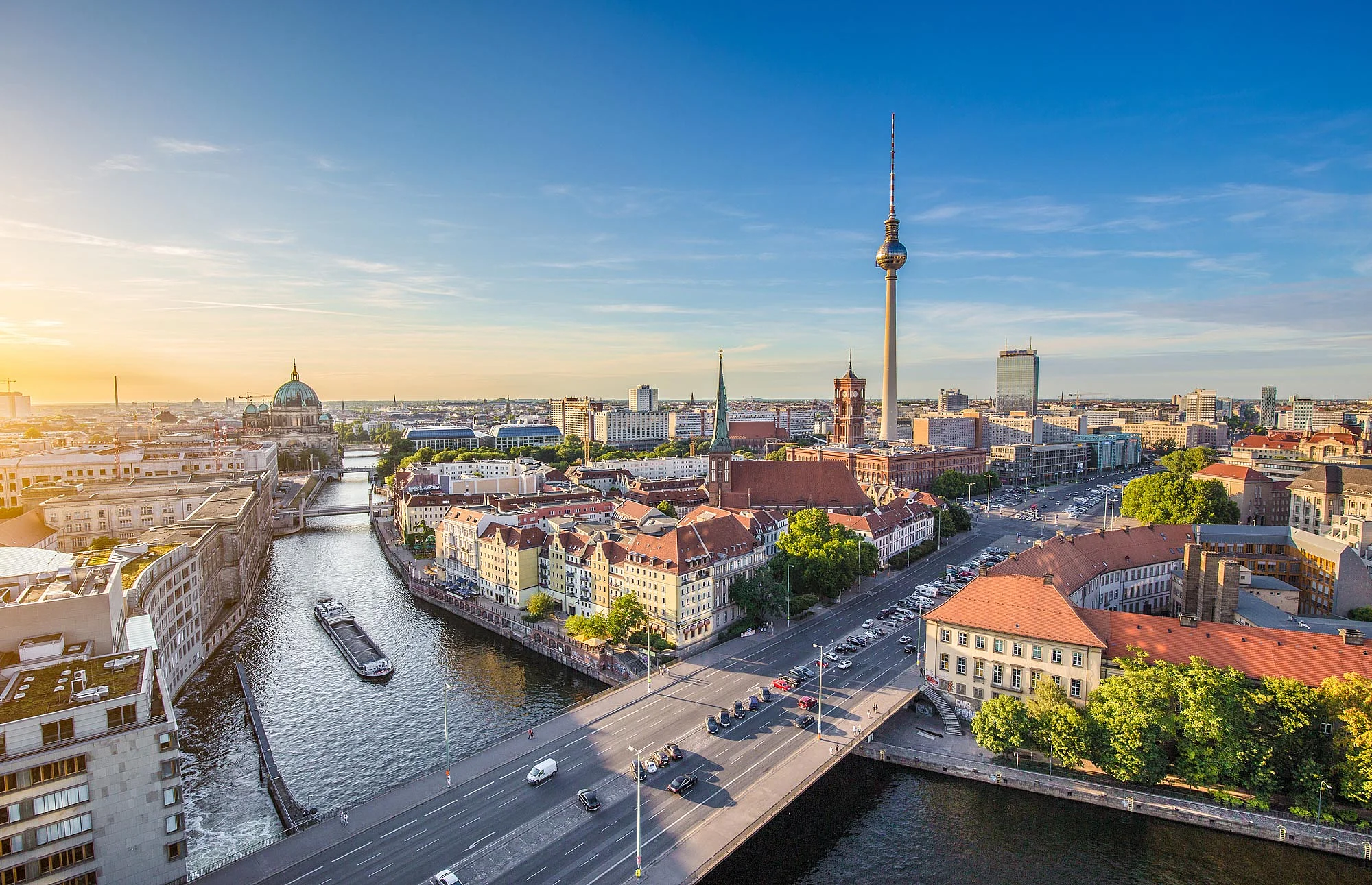 Aerial view of the Berlin skyline with the famous TV tower and the Spree River in beautiful evening light at sunset in summer, Germany