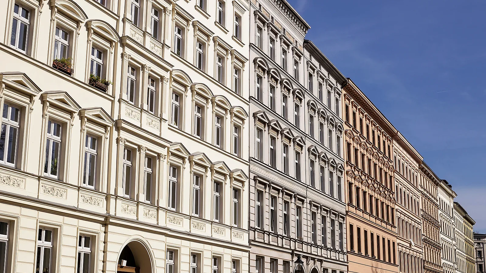 Traditional old residential buildings in the Kreuzberg district of the German capital. A horizontal close-up view of several traditional, classic buildings in a row in Berlin