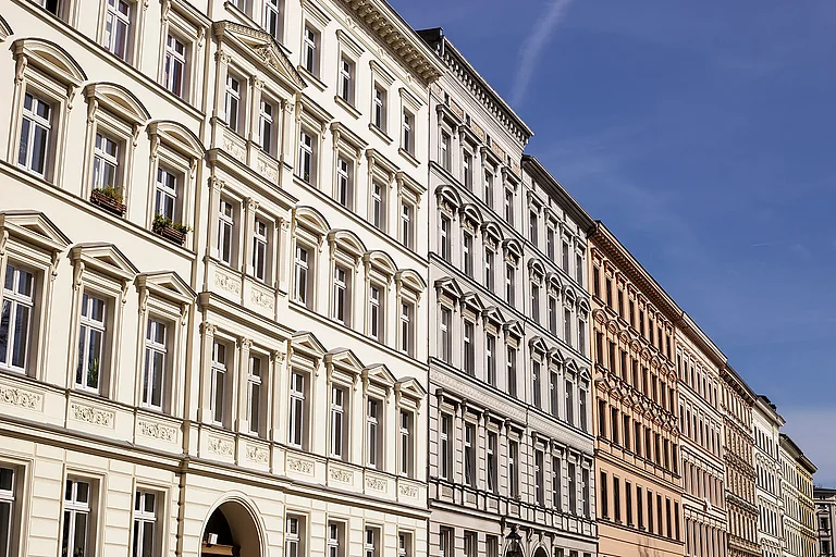 Traditional old residential buildings in the Kreuzberg district of the German capital. A horizontal close-up view of several traditional, classic buildings in a row in Berlin