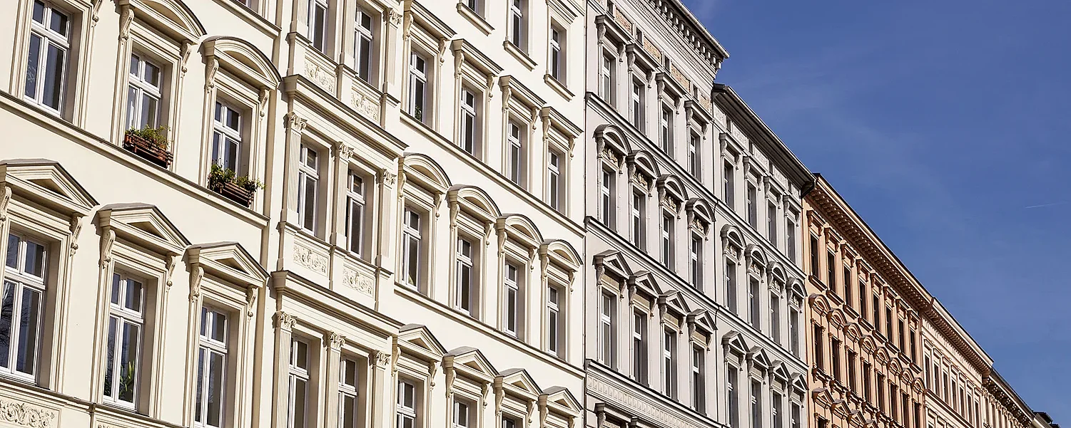 Traditional old residential buildings in the Kreuzberg district of the German capital. A horizontal close-up view of several traditional, classic buildings in a row in Berlin
